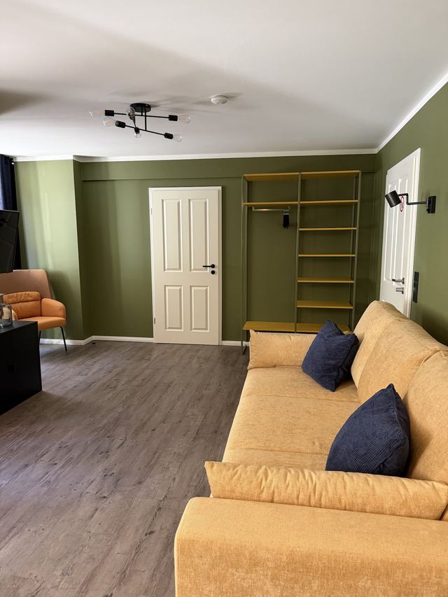 Large living room with sofa in the Amazing Apartment, holiday apartment in Prenzlauer Berg